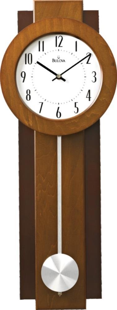 B1929 Annette II. Bent wood case, walnut finish. Mirror polished goldtone bezel. Metal dial with gold metallic accents. Westminster melody on the hour. Clear protective lens.