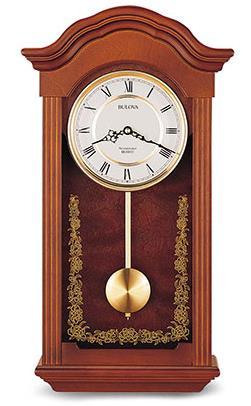 C4443 BARONET. Solid wood case, mahogany finish. Westminster melody on the hour. Decorative screened glass. H: 22.