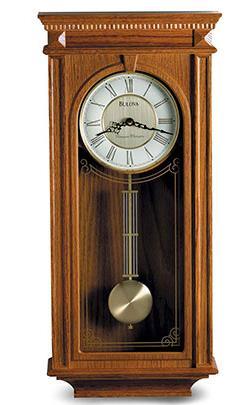 25 inch W: 11.25 inch D: 4.75 inch C4437 Bulova Clock. RIDGEDALE. Solid wood case, walnut finish. Decorative carved accents.