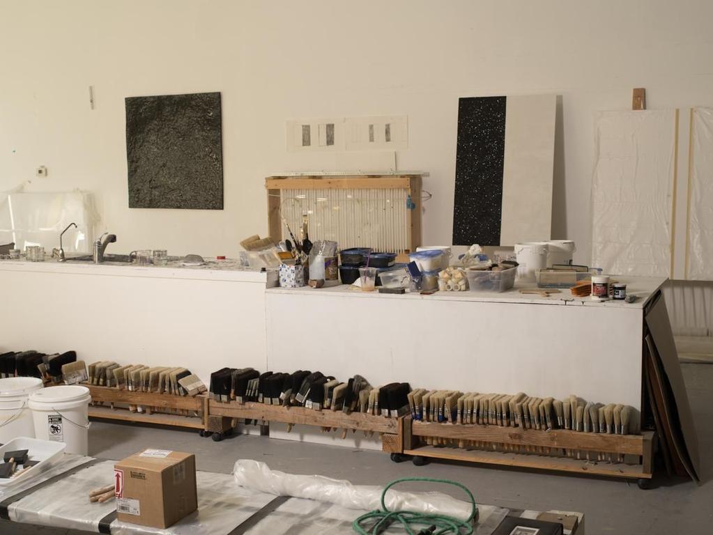 A scene from Corse s studio. From left, Black Earth, fired earth clay, 48 x 48 inches, circa 1975 and works in progress. PHOTO: CAROLYN DRAKE FOR WSJ.