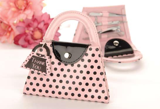 Pink Polka Purse Manicure Set Four-piece, stainless-steel set includes nail file, scissors, clippers and