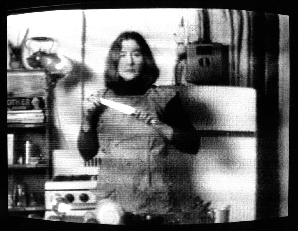 Martha Rosler, Semiotics of the Kitchen (still), 1975. Black-and-white video, 6 minutes 13 seconds. Martha Rosler.