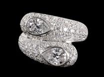 382 383 384 385 386 Lot 384 A serpent-shaped diamond and platinum ring Ring size 9.