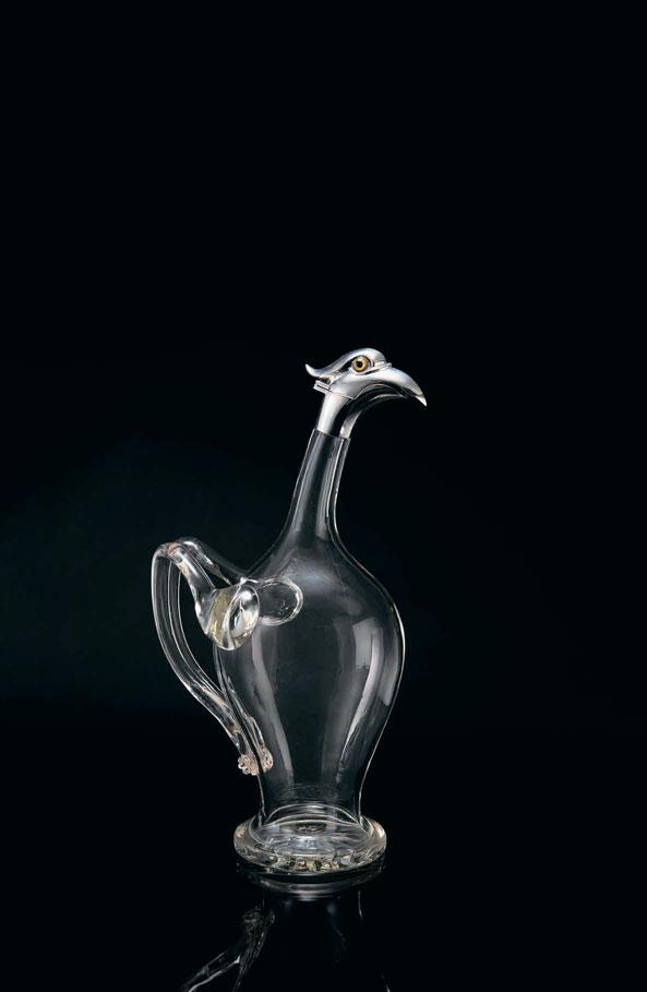 2082 AUSTRIAN A RARE SILVER-MOUNTED GLASS NOVELTY BIRD DECANTER CIRCA 1900 Shaped glass body with ribbed handle,