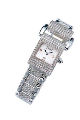 2034 2034 PIAGET A FINE LADY'S WHITE GOLD AND DIAMOND-SET BRACELET WATCH WITH MOTHER-OF-PEARL DIAL REF. 5224, MISS PROTOCOLE, CASE NO.