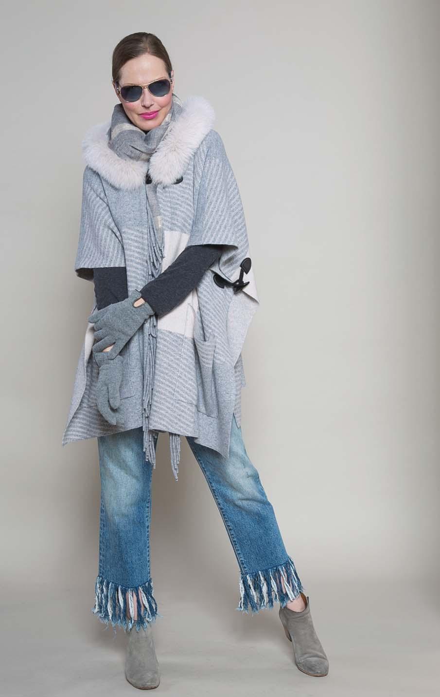 THE FRINGED WRAP with fox trimmed hood. Neutral/grey, Black/grey. One size. $350 GAYNOR OF ITALY tone on tone scarf with sparkle.