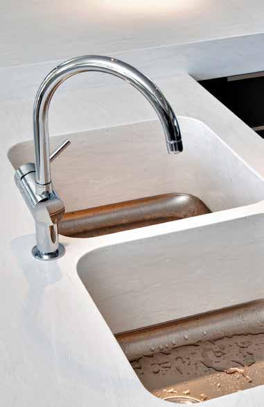 Cleaning your Integrated Corian Sink Simple clean Fats and oils can easily be removed using a damp sponge or cloth along with washing-up liquid or a general purpose ammonia-based cleanser.