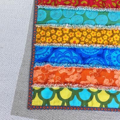 Learn the basics of creating a strip quilt with shaggy chenille-like