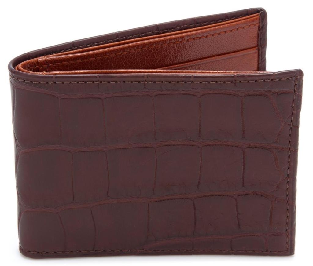 Genuine Alligator Slimfold Wallet Material: Genuine American alligator with a light luster Interior: French calfskin Dimensions: 4.375 W x 3.