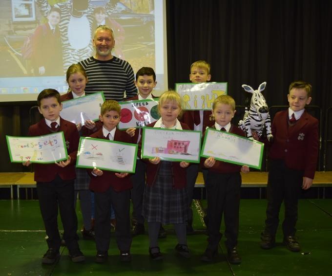 Road Safety poster winners with Dom in the Road Safety Assembly