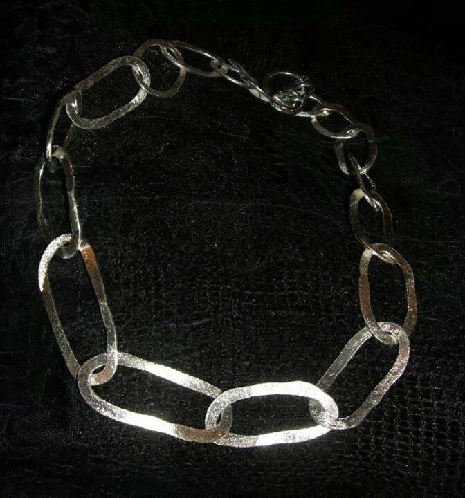 Prize number 10 Sterling Silver Necklace in oval/freeform shapes. It will look similar to this example of a previous one I have made. My name is Hilda Davidson.