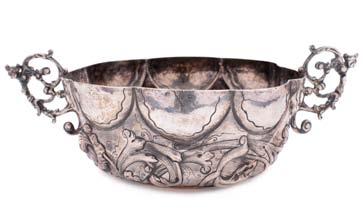 A Portugese bowl of lobed form, with embossed trailing foliate decoration and pierced cast foliate handles, 17.5cm. diameter, 9.