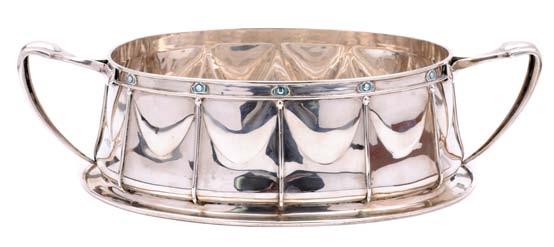A George V oval fruit basket with scrolled cast handles and bracket feet, the sides pierced with foliate scrollwork beneath a gadrooned rim, Birmingham 1928, length handle to handle 28cm, weight