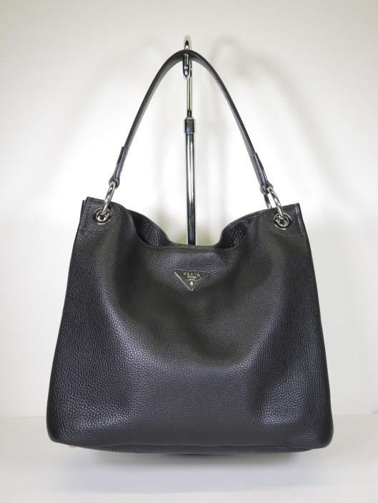 PRADA Black Pebbled Leather Shoulder Bag Sold in one day for $599. 01/26/19 Perfectly practical, this black pebbled leather shoulder bag by Prada is an every-day musthave.