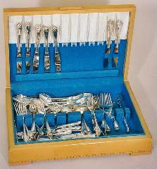 Set of 12 French silver dessert knives and forks. Sterling silver dresser set. Edwardian ivory handled silver plated crumb scoop with silver mount. Crystal chandelier.
