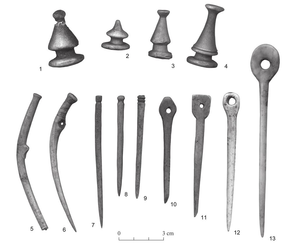 From the Neolithic to the Bronze Age: continuity and changes in bone artefacts in Saaremaa, Estonia 253 Fig. 14. Antler double buttons (1-4) and bone pins (5-13) from the Bronze Age site of Asva.