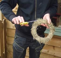 Scented hay rings Pull a bundle of hay into smaller clumps.