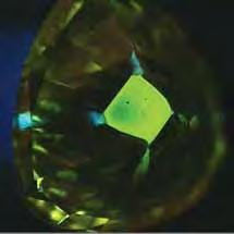 Figure 13. The fluorescence patterns in these DiamondView images of two of the small synthetic stones are diagnostic of synthetic diamond.