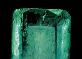 Figure 4. The phantom in this 3.38 ct emerald crystal from the Muzo mine in Colombia is an unusual growth feature. Photomicrograph by John I. Koivula; courtesy of microworld of Gems. Figure 5.