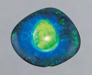 Figure 9. This unusual 1.8 1.6 cm opal triplet bears a striking resemblance to an eye. Courtesy of Bill Hawes; photo by Maha Calderon.