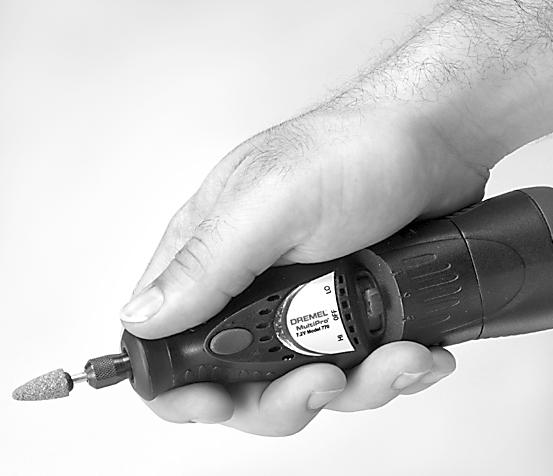For best control in close work, grip the Rotary Tool like a pencil between your thumb and forefinger.