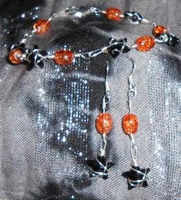 that resemble garnet gems at a lower cost. sp1 $60.00 Special edition bracelet and earrings set.