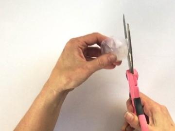 Trim around the outside of your gem with scissors until it's nice and round.