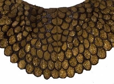 gold ceremonial cape auction photo showing shape and layout of feathers, and detail of shoulder feathers Photo: Heritage Auctions Left: Elizabeth Taylor in cape stepping from sphinx from