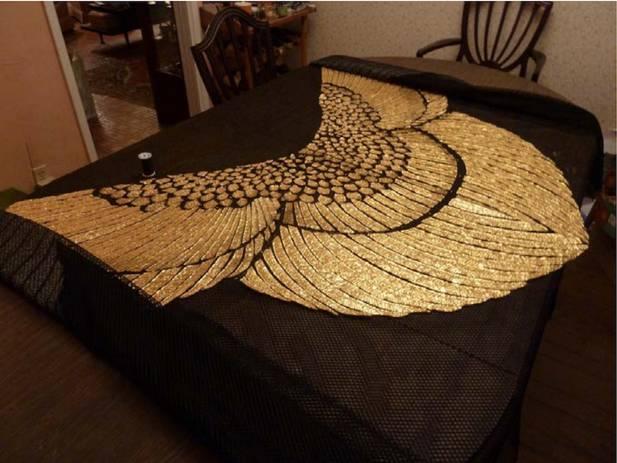 After completing the beading, all of the sections were trimmed and re-assembled on the coarse cargo net base lying over the second full-sized pattern to ensure proper alignment.