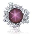 2516 A 11.02 CARAT BURMESE STAR RUBY AND DIAMOND RING Centering upon a star ruby weighing approximately 11.
