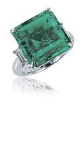 2522 A 14.27 CARAT COLOMBIAN EMERALD AND DIAMOND RING on either side by baguette-cut diamonds, mounted in platinum, ring size 6 3 / 4 Accompanied by report no.