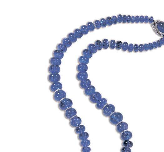 2638 A TANZANITE AND DIAMOND PENDANT NECKLACE Designed as a graduated strand of tanzanite beads, accented by