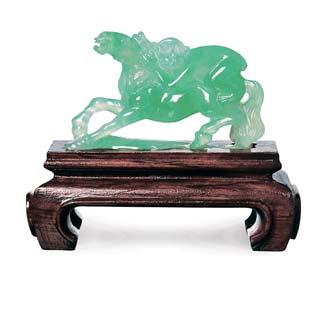 2670 2671 2670 A CARVED JADEITE HORSE AND MONKEY WITH A WOODEN STAND Accompanied by report no.