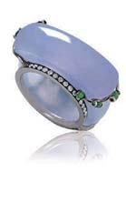 2679 2679 A LARGE JADEITE SADDLE RING tsavorite, sapphire and diamond double hoops, enhanced by jadeite cabochon detail, saddle measuring approximately 31.12 x 32.27 x 19.56 x 10.