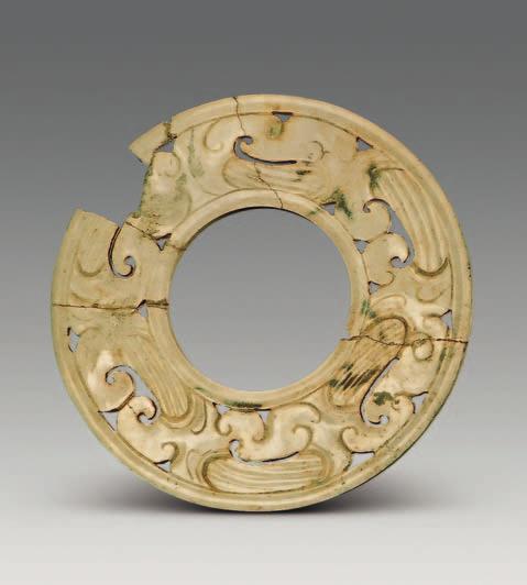 Each space between two animals is carved with an image of a rolling cloud. The jade is 8.8 cm across (Figs.
