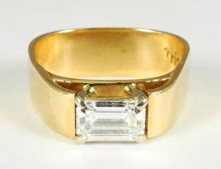 $7,000 - $9,000 14k yellow gold and jade ring.