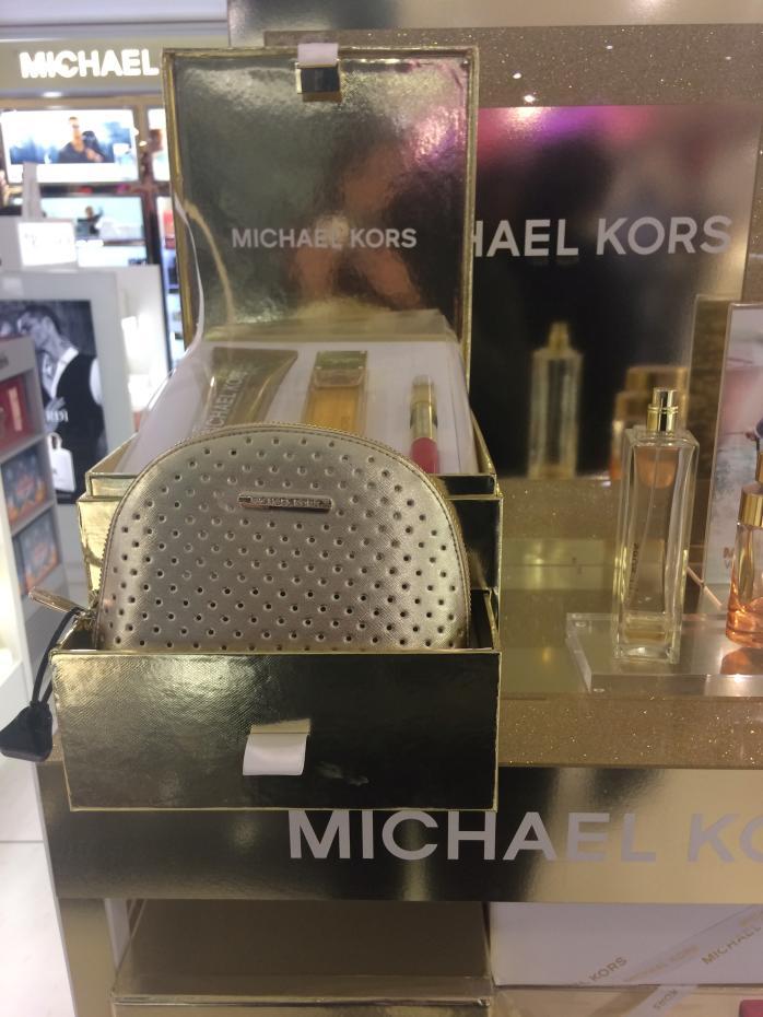 Michael Kors Deluxe Glam Jasmine 1. Metallic Jewellery Box and Metallic PU Pouch. 2. Jewellery Box and Pouch free with Eau De Parfum, Body Lotion and Rollerball - set costs 88. 3.