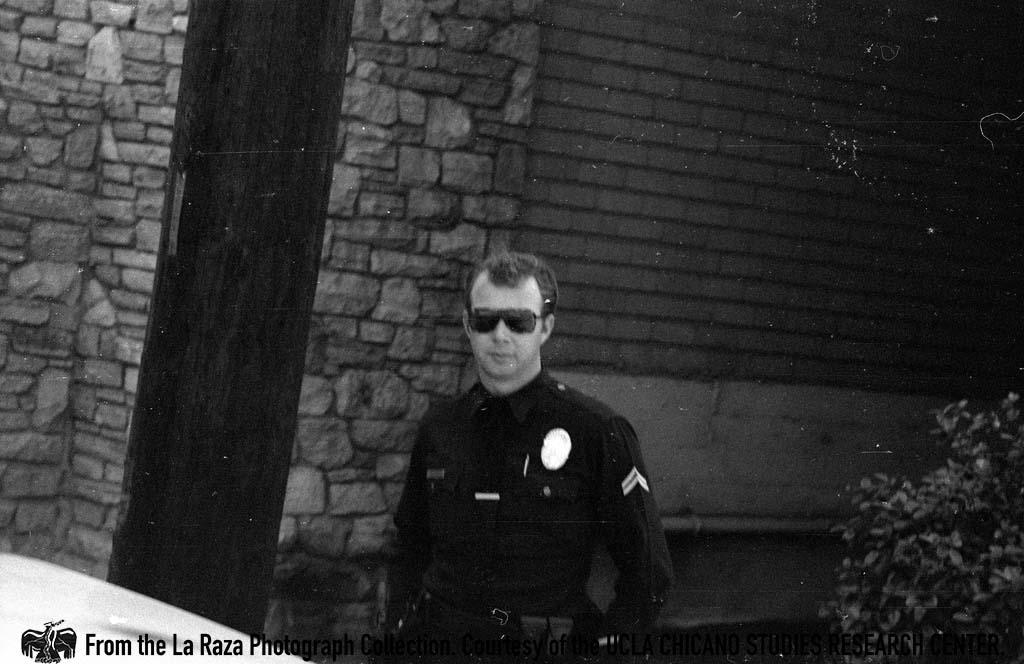 LAPD officer at a Vietnam protest La Raza photograph
