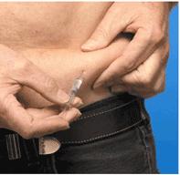 3. Hold the syringe the way you would a pencil or a dart and insert the needle straight (90 degree angle) into