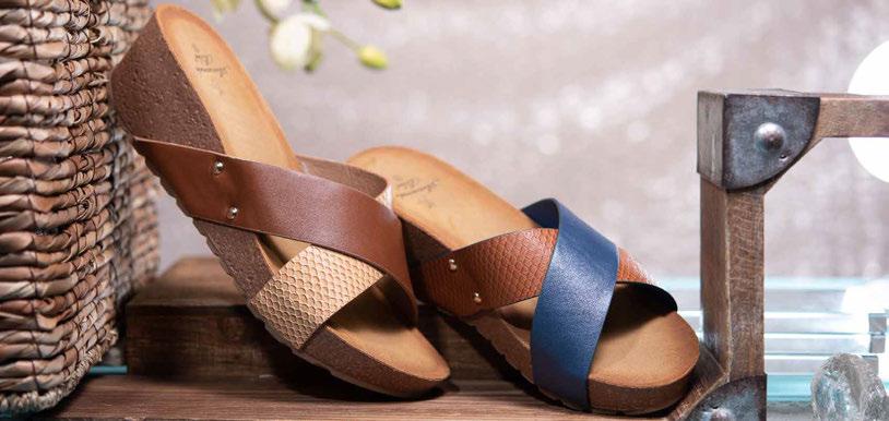 SLIDES ARE AN IMPORTANT LOOK IN SUMMER FOOTWEAR, AND THESE FAUX SUEDE SLIDES WITH CORK COVERED WEDGE HEELS ARE SURE TO FIT INTO ANY CASUAL WARDROBE. Karinne Slide CASE OF 12 PAIRS $210.00 $17.