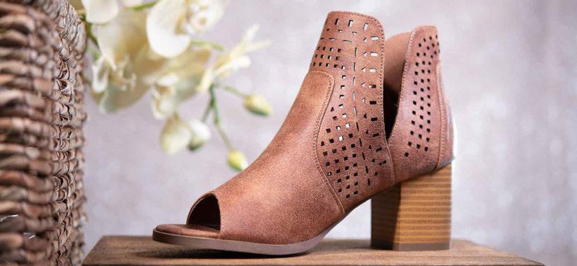 OUR LASER-CUT BOOTIES WILL FIT PERFECTLY INTO YOUR TRANSITIONAL WARDROBE. FEATURES A 3 STACKED HEEL.