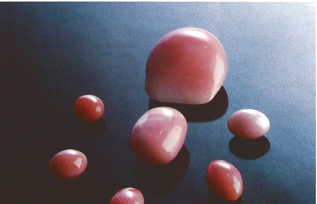 Figure 1. This group of exceptional pink conch "pearls" includes some of the finest that were studied for this article. The largest, an unusually fine porcelaneous "pearl," weighs 40.