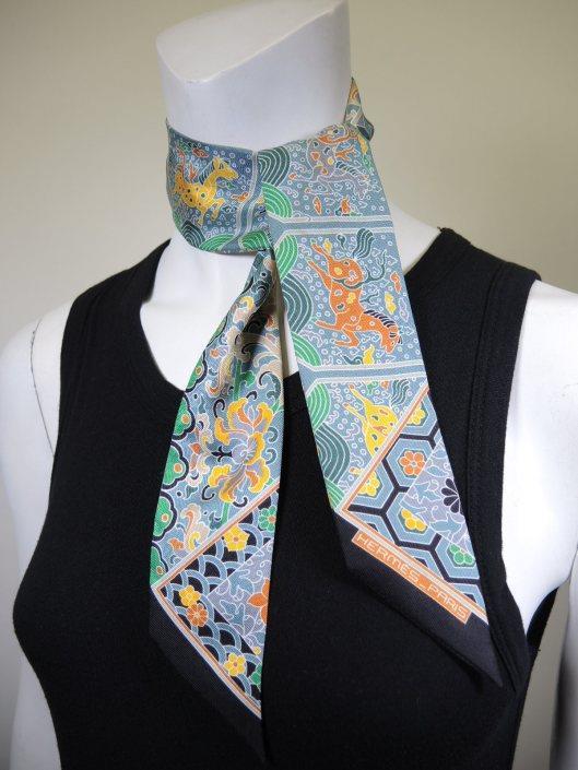 HERMÈS Blue and Green Twilly Neck Tie Sold in one day for $89. 03/10/18 Add just a hint of Hermès luxury to your Spring outfits with this adorable silk neck scarf.