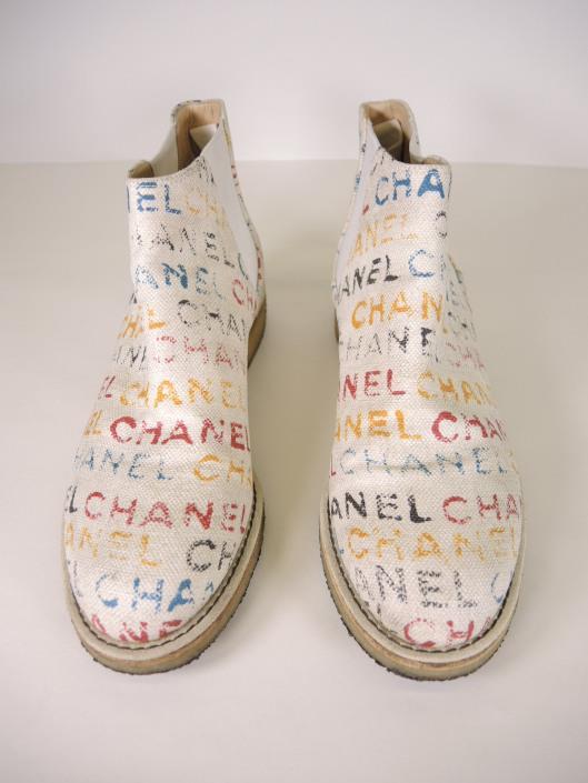 CHANEL White Signature Painted Canvas Ankle Boots, Size 8 Sold in one day for $399. 03/02/18 We love these graffiti inspired booties from Chanel s 2014 Spring Collection.