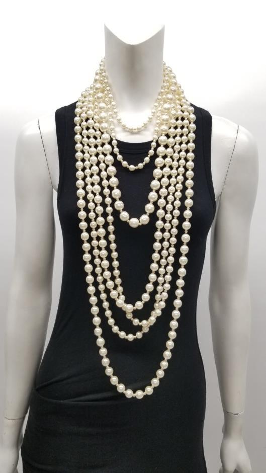 CHANEL 1995 Faux Pearl Multi Strand Bib Necklace Sold in one day for $499. 04/14/18 Coco Chanel notoriously draped herself in pearls, adding layers upon layers.
