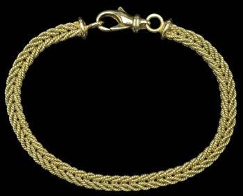 40 A VICTORIAN GOLD FRINGE NECKLACE, of scroll engraved leaf-shaped links, with applied plaque stamped 9c, to later ring bolt clasp, necklace length 44cm, weight 19gm.