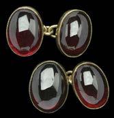 1800-2200 63 A VICTORIAN GOLD CABOCHON GARNET SET BRACELET, of oval hoop links, each centred with a collet set cabochon garnet, with brick-link