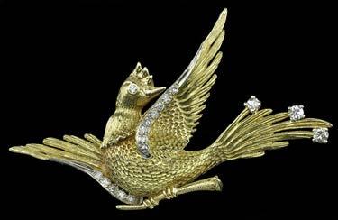 93 AN 18CT GOLD AND DIAMOND SET BIRD BROOCH, modelled as a bird on a branch, with outspread wings, with textured