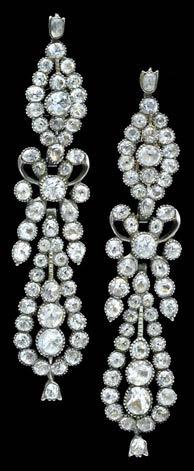 141 A PAIR OF WHITE PASTE EARPENDANTS, LAST QUARTER OF 18TH CENTURY, the long pendeloque drops with central ribbon bow detail, set throughout with facetted white paste in foiled closed back settings,