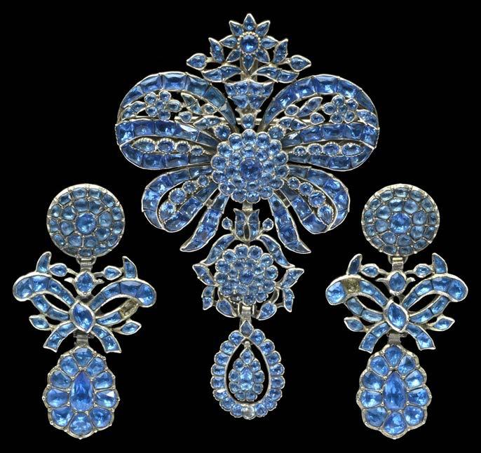 145 AN 18TH CENTURY BLUE PASTE BROOCH/PENDANT AND EARPENDANT SUITE, the pendant of sévigné design suspending a circular cluster drop with foliate surround and further pear-shaped cluster drop below,